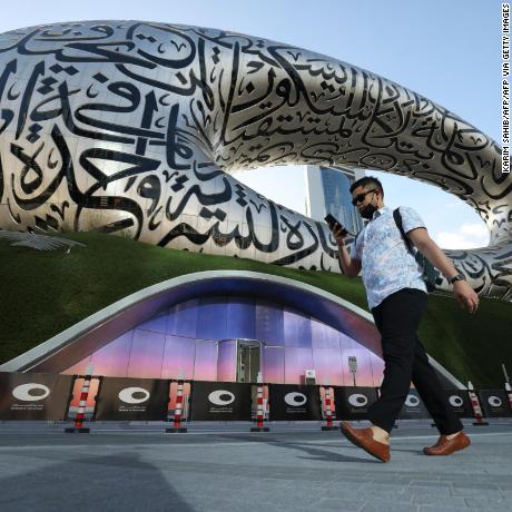 A man walks on February 7, 2022 past Dubai&#39;s Museum of the Future, which will open to the public on February 22. - The Gulf emirate&#39;s new building was named one of the 14 most beautiful museums on the planet in a list compiled by National Geographic magazine last summer. (Photo by Karim SAHIB / AFP) (Photo by KARIM SAHIB/AFP via Getty Images)