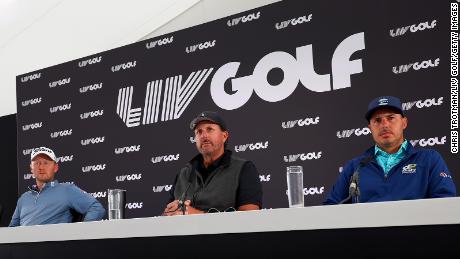 Mickelson speaks at a press conference, sitting next to Justin Harding and Chase Koepka.