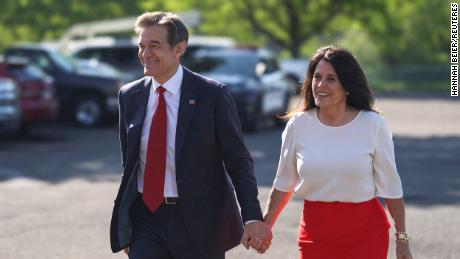 Mehmet Oz and his wife Lisa Oz arrive to cast their vote in Pennsylvania's Republican primary on May 17, 2022. REUTERS/Hannah Beier
