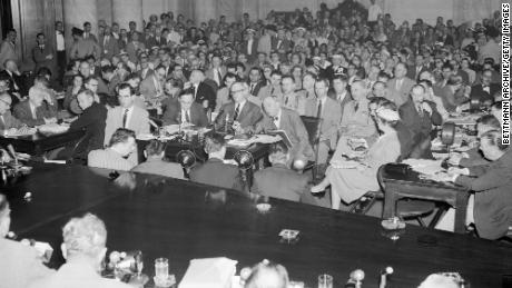 The Senate Caucus Room as the Army-McCarthy hearings were resumed after a week&#39;s research, on May 24, 1954 in Washington, DC. On the witness stand (left to right), James St. Clair, assistant army counselor; Army Secretary Robert T. Stevens; and Joseph Welch, Army counsel.