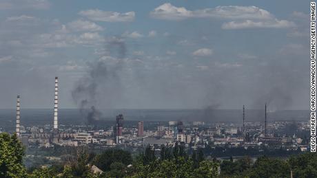 Smoke rises over the city of Severodonetsk, as seen from Lysichansk, Lugansk region of Ukraine, on June 8, 2022.