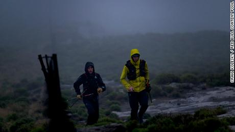 Griesel and Sandes making a big push up one of Lesotho's many mountains during a particularly rainy day.