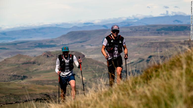 Sandes and Griesel look forward to spending more time on their home continent. Here they&#39;re pictured trekking up a steep incline during their Navigate Lesotho run.