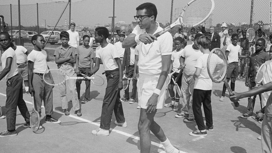 Ashe works with children during a tennis clinic in Washington, DC, in 1968.