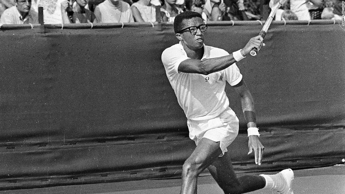 Ashe returns a shot during a Davis Cup match in Cleveland in 1968. The United States won the competition that year.