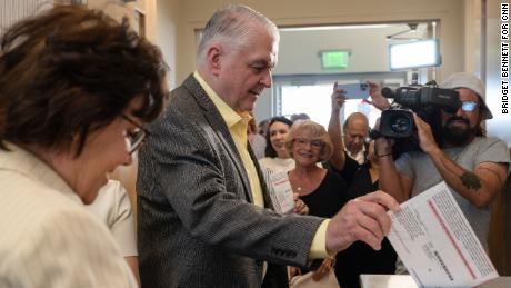 Democratic Gov. Steve Sisolak of Nevada drops his ballot at a polling location on June 1, 2022 in Las Vegas, Nevada.