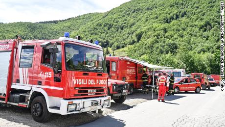 Rescue teams search for the missing helicopter on Saturday in Pievepelago, Italy. 