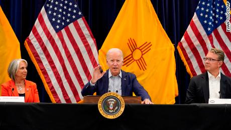 President Joe Biden, center, speaks during a briefing on the New Mexico wildfires with New Mexico Gov. Michelle Lujan Grisham, left, and David Dye, New Mexico secretary of homeland security and emergency management, at the New Mexico State Emergency Operations Center, Saturday, June 11, 2022, in Santa Fe, N.M. (AP Photo/Evan Vucci)