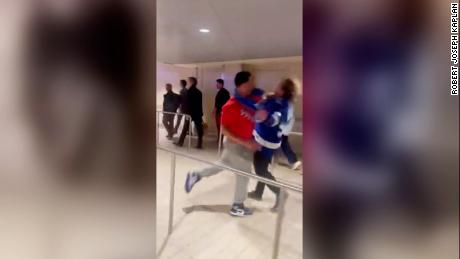 A man was arrested and charged after allegedly assaulting two men at Madison Square Garden Thursday, officials said.