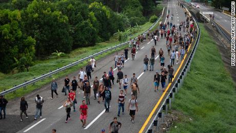 Migrants taking part in a caravan heading to the US, walk from Huixtla to Escuintla, Chiapas state, Mexico, on June 9, 2022.