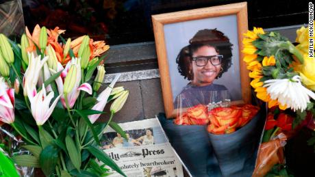 A memorial honors Sierra Jenkins and others shot outside a pizza restaurant in Norfolk, Virginia, in March.