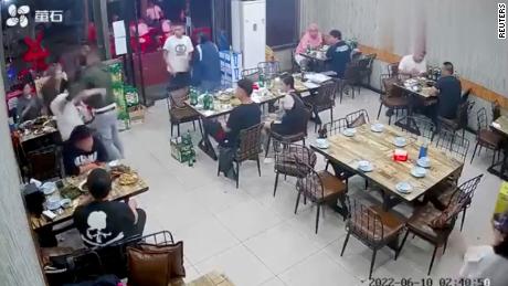A man assaults a woman at a restaurant in Tangshan, China, in  screen grab taken from surveillance footage obtained by REUTERS on June 12, 2022. Video Obtained By Reuters/via REUTERS  THIS IMAGE HAS BEEN SUPPLIED BY A THIRD PARTY.