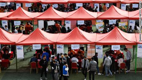 Students look for job during a campus job fair in Xining, northwest China&#39;s Qinghai Province, March 24, 2022. 