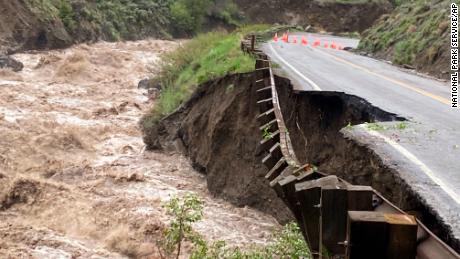 A highway in Yellowstone National Park partially collapsed due to flooding on Monday. 