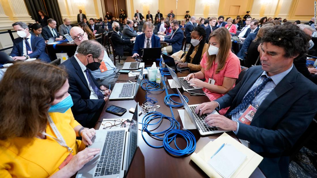 Members of the media work at the Capitol on June 13.