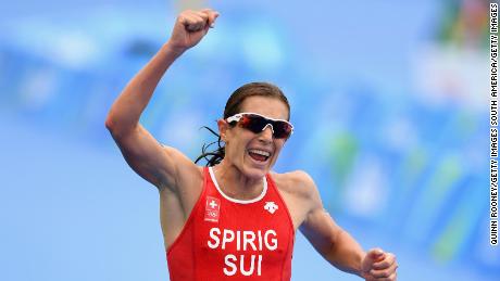 RIO DE JANEIRO, BRAZIL - AUGUST 20:  Nicola Spirig Hug of Switzerland celebrates as she approaches the line to win silver during the Women&#39;s Triathlon on Day 15 of the Rio 2016 Olympic Games at Fort Copacabana on August 20, 2016 in Rio de Janeiro, Brazil.  (Photo by Quinn Rooney/Getty Images)