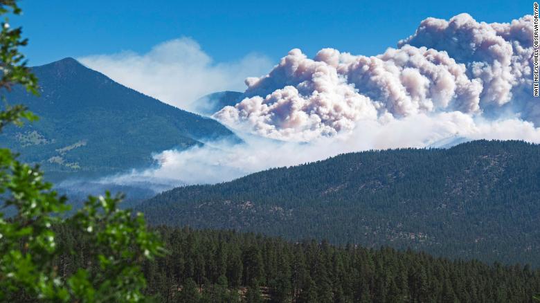 Firefighters face windy conditions as blazes grow near Flagstaff, Arizona, prompting hundreds of evacuations