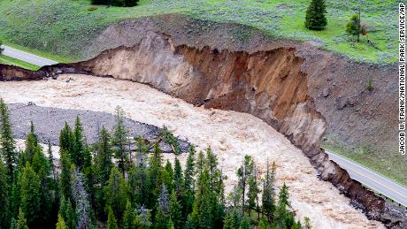 A road near the northern entrance to Yellowstone National Park was badly damaged by flooding.