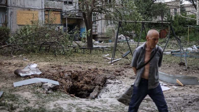 A local resident walks in front of an apartment building destroyed in a missile strike, amid Russia&#39;s invasion of Ukraine, in Bakhmut, Ukraine, June 13, 2022. 