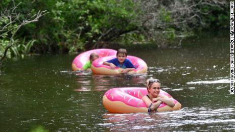 Liz Havard, Philip Smith and Miles Havard cool off Monday as they float down Turkey Creek in Niceville, Florida. The National Weather Service in Mobile issued a heat advisory for Monday and Tuesday, with heat index temperatures topping 100 degrees along the Florida panhandle. 