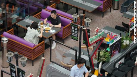 Customers at a restaurant in Huaxi Live shopping plaza in the Haidian district of Beijing, June 6, 2022.  