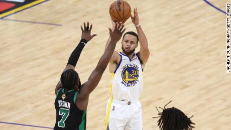Steph Curry shoots a three pointer against Jaylen Brown of the Boston Celtics during the third quarter of Game 5 of the 2022 NBA Finals.
