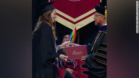 Dozens of graduating seniors at Seattle Pacific University (SPU) handed small rainbow pride flags to Interim President Pete Menjares in protest of the school&#39;s anti-LGBTQ+ employment policy. (engaygetheculture/TikTok)