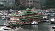 A video frame grab from AFPTV footage show Hong Kong&#39;s Jumbo Floating Restaurant, an iconic but aging tourist attraction designed like a Chinese imperial palace, being towed out of Aberdeen Harbour on June 14, 2022, after years of revitalisation efforts went nowhere. (Photo by Yan ZHAO / AFPTV / AFP) (Photo by YAN ZHAO/AFPTV/AFP via Getty Images)