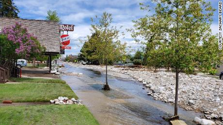 Images taken Tuesday afternoon show the aftermath of flooding in Red Lodge, Montana.  The pictures show the street covered in rocks and debris caused by the rising water level.
