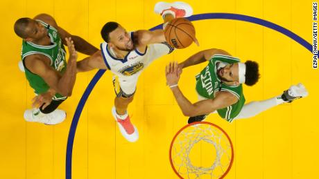 Curry shoots in the first half of Game 2 against the Boston Celtics.