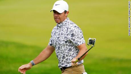 McIlroy reacts to his putt on the 12th hole.