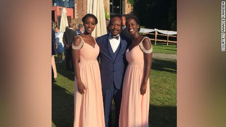 Carine Kanimba (left), Paul Rusesabgina (center), Anaise Kanimba (right) at a family wedding in Belgium in 2017.