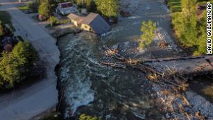 A house sits in Rock Creek after floodwaters washed away a road and a bridge in Red Lodge, Montana, on Wednesday, June 15.
