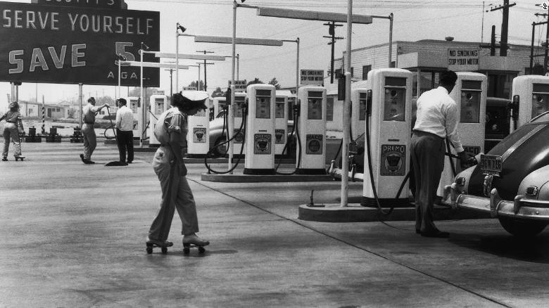 Self-service gas stations, like this early one in 1948, became popular as stations lost their hold on the auto service and repair market.