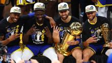 Andre Iguodala, Draymond Green, Klay Thompson and Carey pose for a photo after their victory over the Boston Celtics in Game Six of the 2022 NBA Finals.