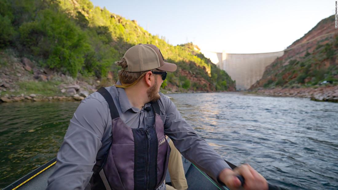 From a boat on the Green River, Stephen Lytle looks upstream at the Flaming Gorge Dam.