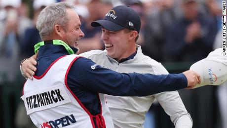 Fitzpatrick celebrates winning the US Open with caddy Billy Foster.