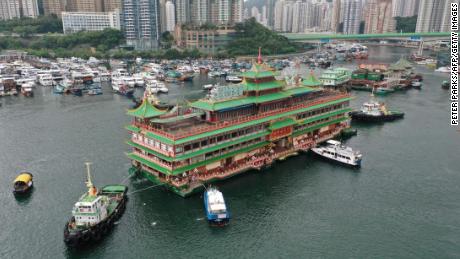 Hong Kong's Jumbo Floating Restaurant, an iconic but aging tourist attraction designed like a Chinese imperial palace, will be towed out of Aberdeen Harbor on June 14, 2022.
