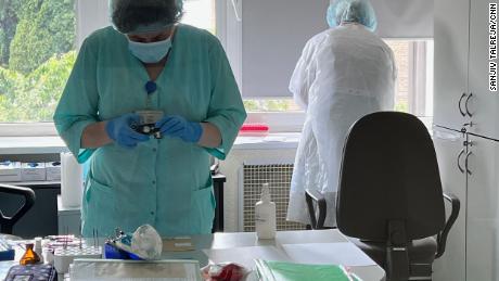 Analysts process DNA samples at the Ministry of Internal Affairs&#39; laboratory in Kyiv, Ukraine. 
