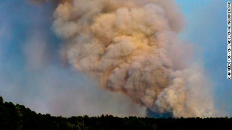 Smoke billows from a wildfire in Wharton State Park near Hammonton, New Jersey, on Monday, June 20, 2022.