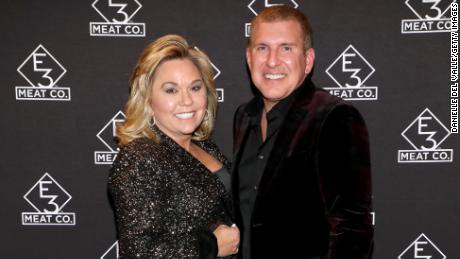 (From left) Julie Chrisley and Todd Chrisley attend the grand opening of E3 Chophouse Nashville on November 20, 2019, in Tennessee. 