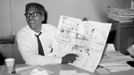 Bayard Rustin, deputy director of the planned march on Washington program, points to a map showing the line of march for the demonstration for civil rights during a news conference in August 1963.