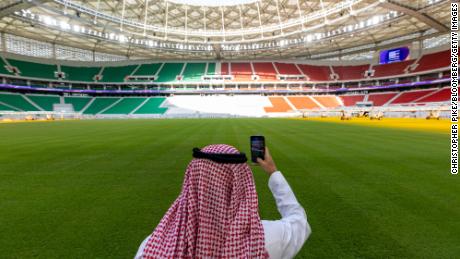 A visitor takes a smartphone photo at the Al Thumama football stadium in Doha, Qatar, on Monday.