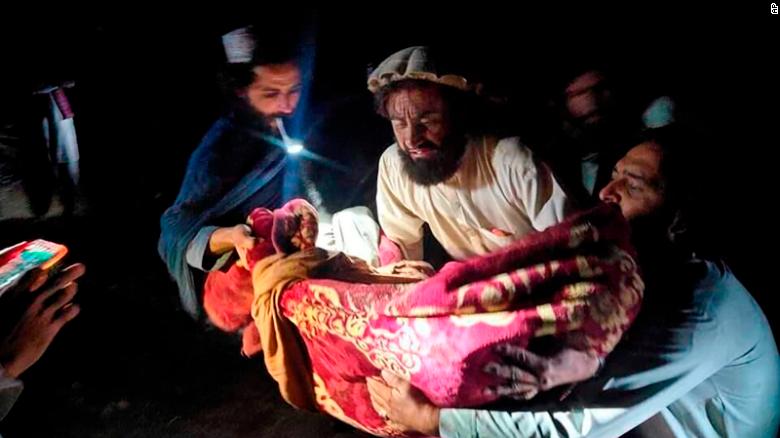 Villagers evacuate an injured earthquake victim in Afghanistan&#39;s Paktika province. 