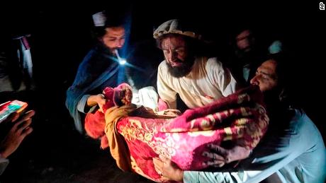 The photo, released by the state-run news agency Bhaktar, shows Afghans evacuating wounded following an earthquake in eastern Afghanistan's Baqtika province.