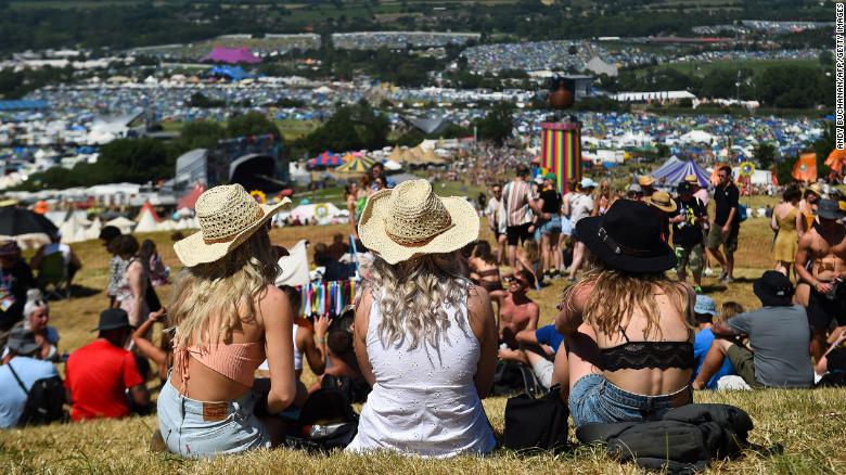 Glastonbury Festivalgoers enjoy the sun and warm weather on Wednesday.