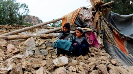 Children near their destroyed home in the Spera district of Afghanistan's Khost province on June 22.