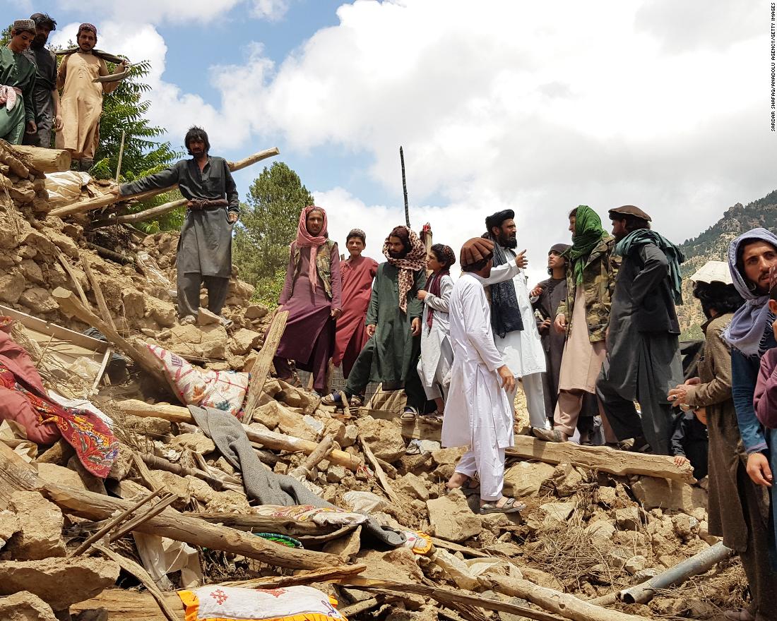 People help in search and rescue operations amid the debris of a building after the earthquake in Afghanistan on June 22.