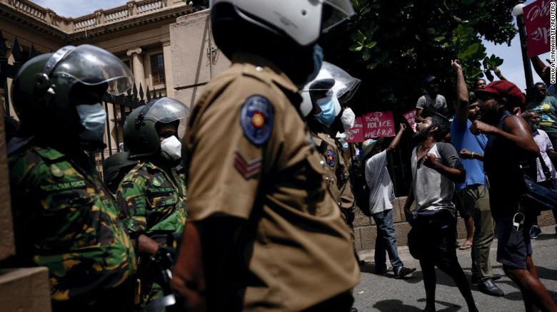 Demonstrators demand the release of protesters who were obstructing an entrance to Sri Lanka&#39;s Presidential Secretariat, amid the country&#39;s economic crisis, in Colombo on June 20.