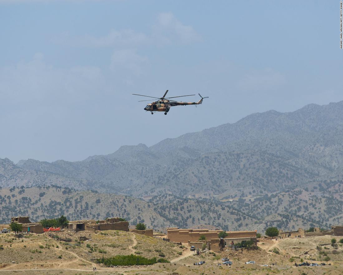 A Taliban military helicopter flies over an earthquake-damaged area in the Paktika province, on June 23.